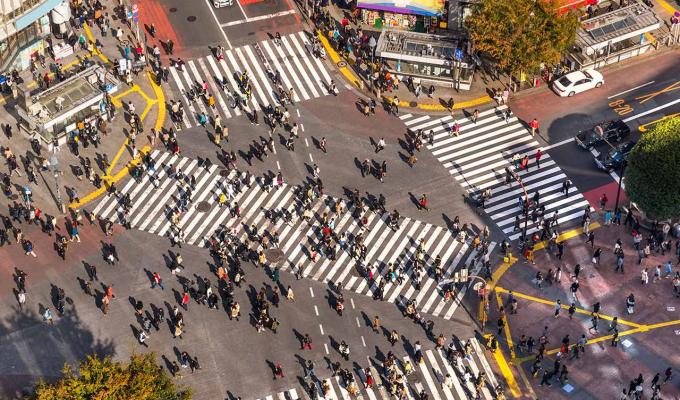 arial view of citizens walking through busy intersection in Japan