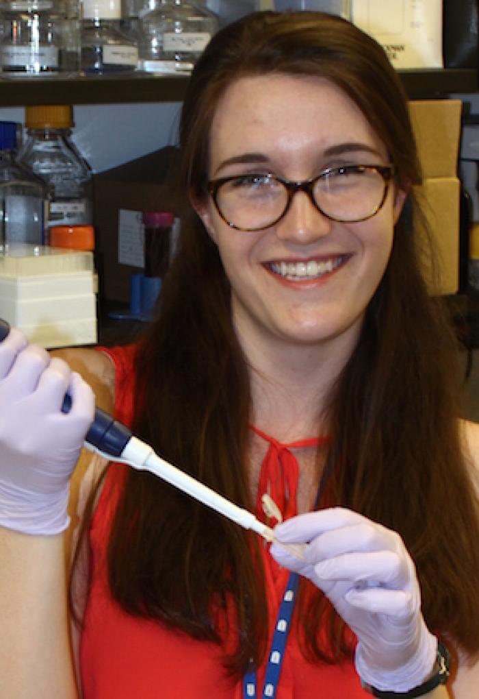 Lynda Bradley with samples in lab