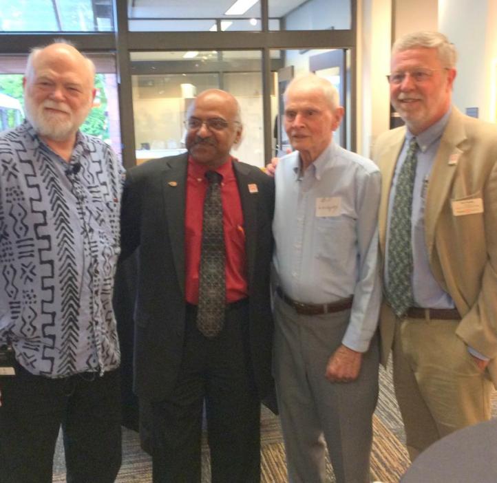 Four men pose together, including Harry Greene, Dean Sastry Pantula, and Bob Mason